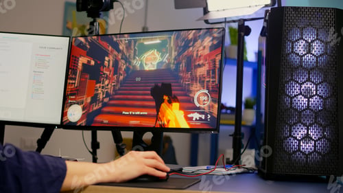 Preview: Close-up of streamer playing first person shooter video game