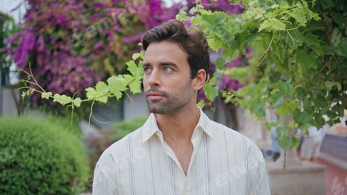 Preview: Romantic man looking distance near grape bush closeup. Latin macho portrait