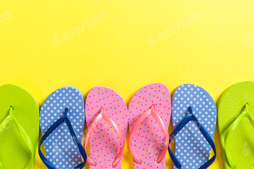 Preview: a lot of flip flop colored sandals, summer vacation on colored background, copy space top view