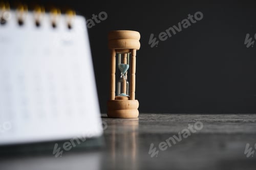 Preview: Close up image of calendar and hourglass with copy space.