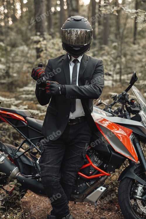 Preview: Handsome biker with helmet and dark motorcycle in forest