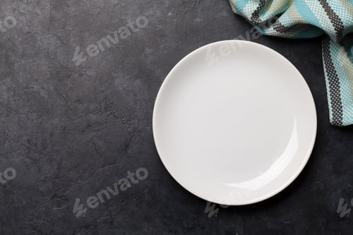 Preview: Kitchen table with plate and tablecloth