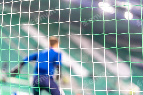 Preview: Blurred view soccer goalkeeper in the goal