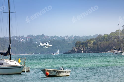 Preview: plane flying over the ocean in Sydney Australia