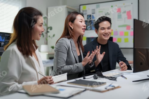 Preview: Business team discussing work in office meeting room