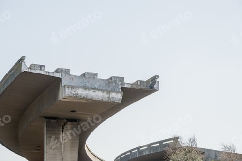 Preview: Low angle shot of an unfinished expressway on a cloudy day