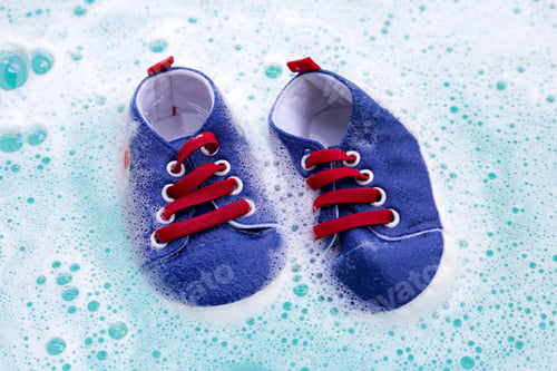 Preview: Soak baby shoes in baby laundry detergent water dissolution before washing. Laundry concept,