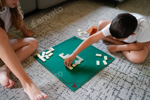 Preview: Two children playing a game of dominoes