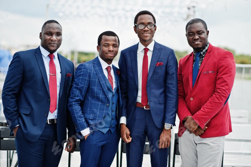 Preview: Group of four african american happy succesfull mans at suit. Rich black business mans.