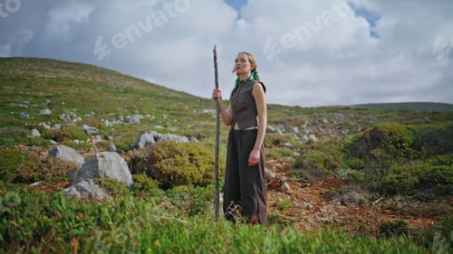 Preview: Hiking woman resting trail at green nature hill. Contemplative wandered admiring