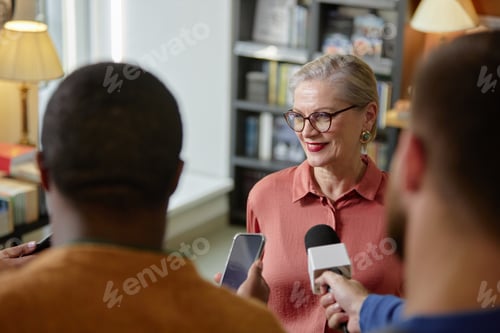 Preview: Senior Caucasian Woman Smiling While Answering Questions during Interview