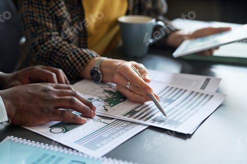 Preview: Business people analyzing report with graphs
