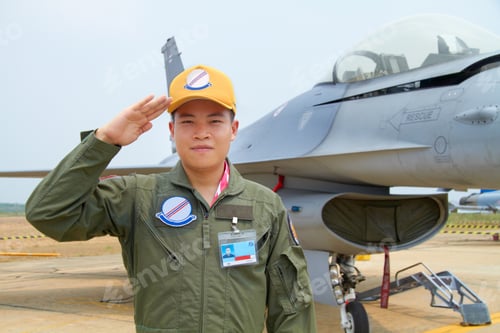Preview: Ready for the danger zone. A shot of a confident asian fighter pilot.