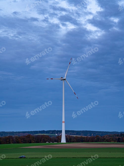 Preview: Wind turbine in the middle of the agricultural field, the concept of sustainable, renewable energy