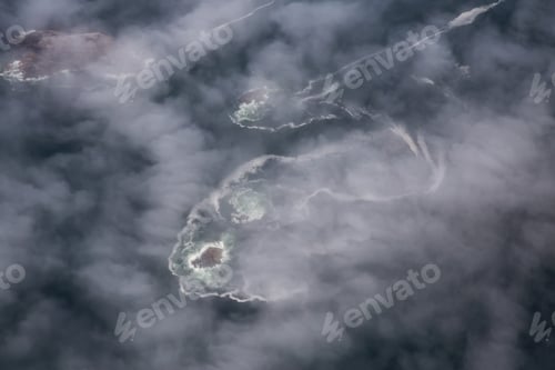 Preview: Aerial View from Above of the Rocky Islands covered in Clouds and Fog