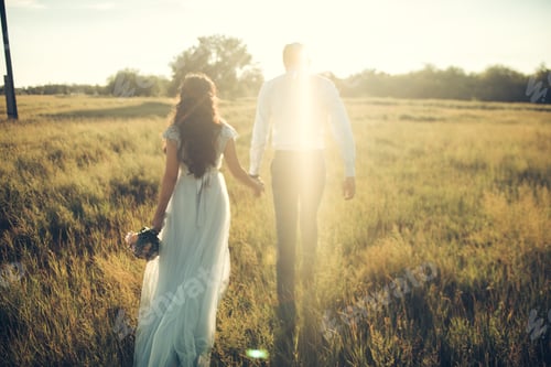 Preview: Loving Couple Walking Together in a Field