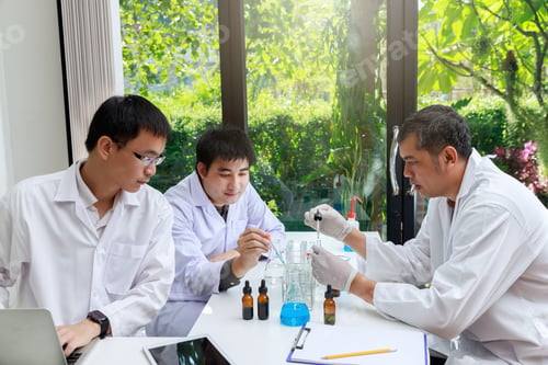 Preview: Team of researcher or scientists working in laboratory.