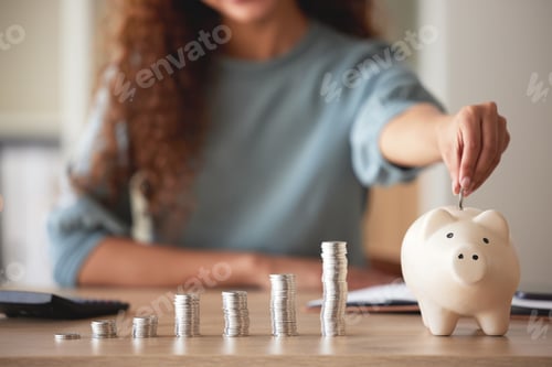 Preview: Woman Saving Money in a Piggy Bank