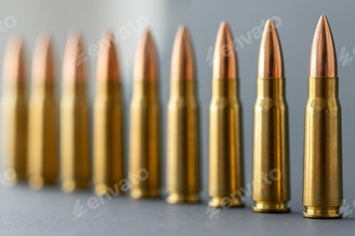 Preview: Bullets on gray background. Cartridges 7.62 caliber for Kalashnikov assault rifle