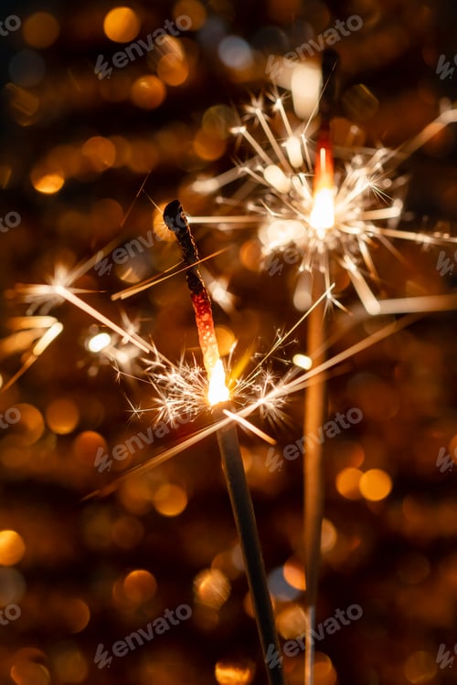 Preview: Christmas bengal fire sparkles against the black background.
