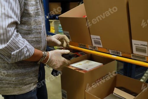 Preview: logistics warehouse - operator with a scanner in his hand