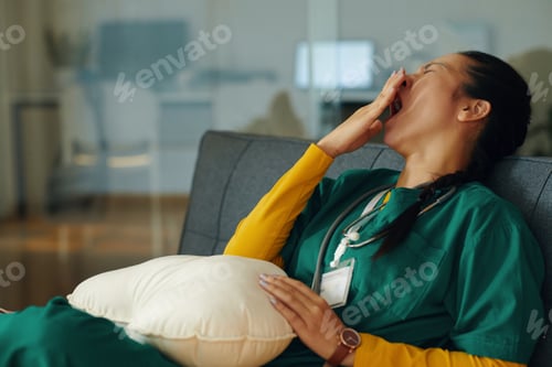 Preview: Yawning Nurse Taking a Break in Hospital Room
