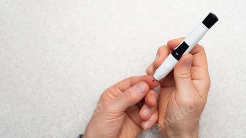 Preview: Caucasian middle aged man pierced his finger for home glucose test flat lay view