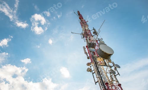 Preview: Low angle view of Antenna tower against a blue sky. 5g network cell tower.