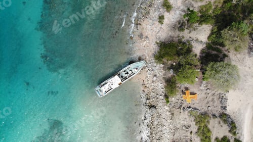 Preview: Bird's eye view of the turquoise bay with a boat. East Timor.