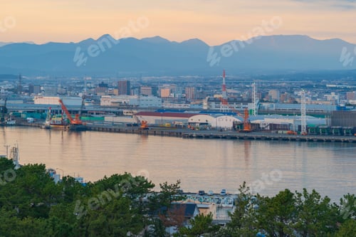 Preview: Petrochemical oil refinery and sea in industrial engineering, urban city. Oil and gas tanks
