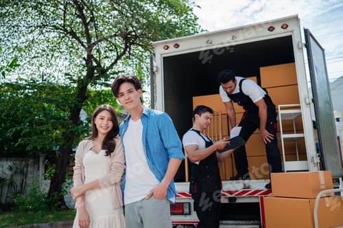 Preview: Asian Couple check while unloading boxes and furniture from a pickup truck