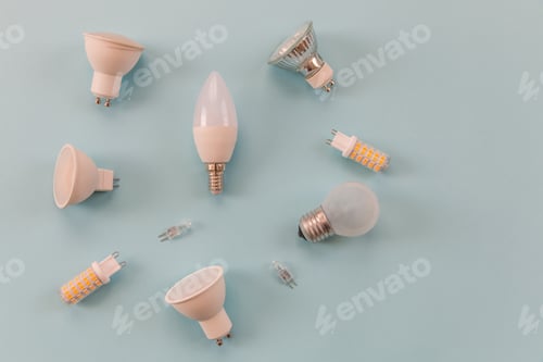 Preview: different types of light bulbs on a blue background. background for text