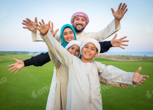 Preview: Arabic Family On Green Meadow In Nature