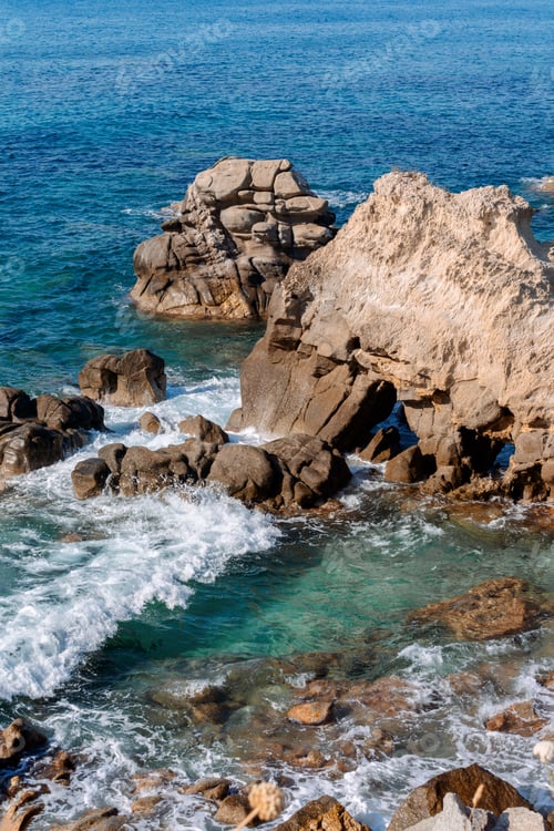 Preview: Waves on rocky beach, sea shore with waves crushing over the big rocks