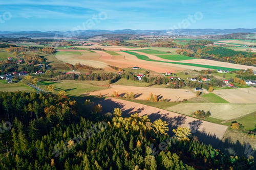 Preview: Mountain village and agricultural fields, aerial view. Nature landscape