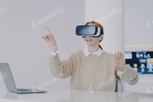 Preview: Young european woman entrepreneur in VR headset. Concept of digital solutions in remote work.