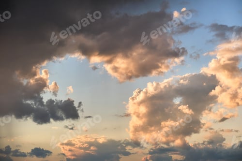 Preview: Bright landscape of dark clouds on yellow sunset sky in evening.