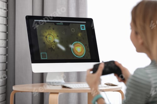 Preview: Young woman playing video game at home, closeup