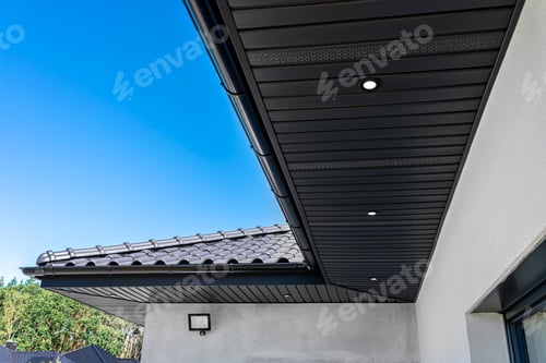 Preview: A modern graphite herringbone roof lining is attached to the trusses, visible turned on LED lights.