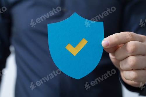Preview: Man holding a protection shield with a checkmark