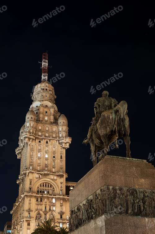 Preview: Public Statue and Skyscraper at Night