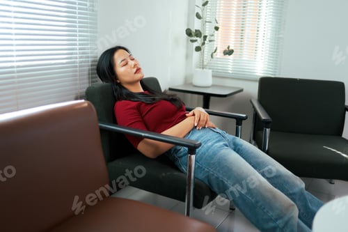 Preview: Young Asian woman sleeping in waiting room chair