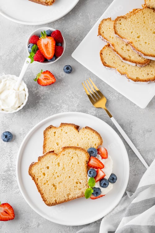Preview: Delicious vanilla pound cake served with fresh berries and whipped cream. Selective focus