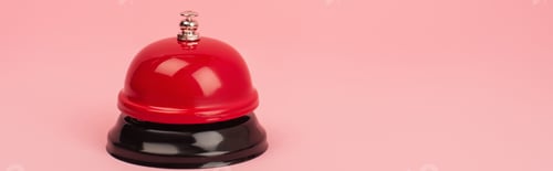 Preview: red and metallic bell isolated on pink, banner