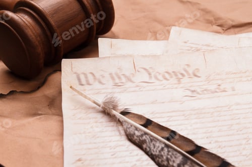 Preview: Quill with old script and wooden gavel.