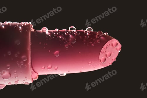 Preview: Red lipstick with water drops on a dark background.