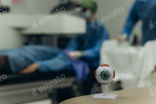 Preview: Eye model in operating room with blurred surgery