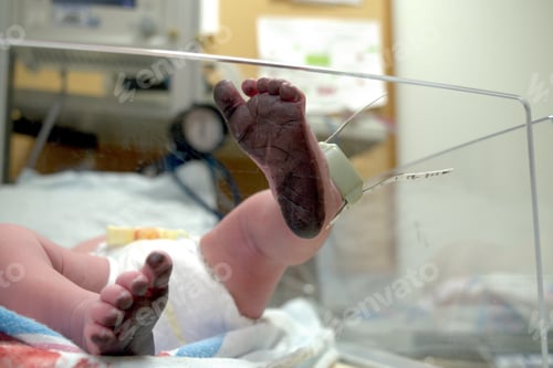 Preview: A newborn baby lies in their bassinet in the hospital nursery moments after their footprints were