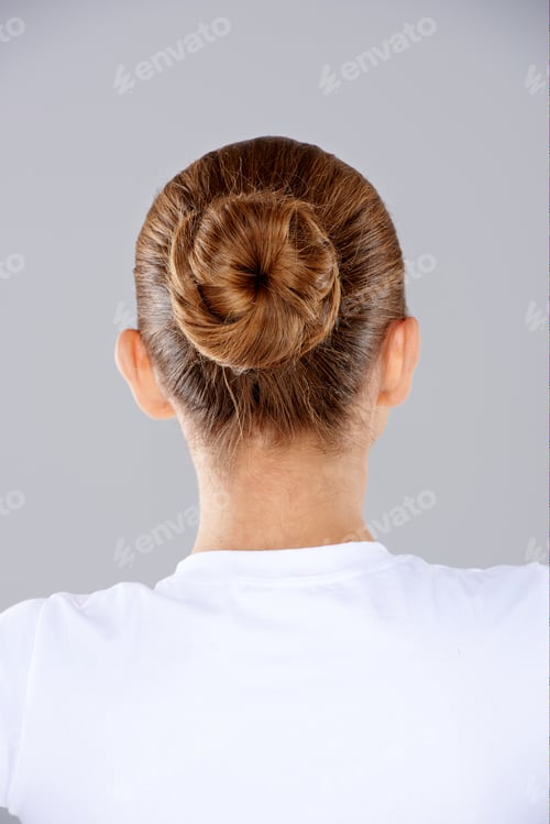 Preview: Woman's Stylish Hair Bun Against Neutral Background