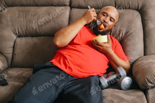 Preview: Fat Man Eating Foods While Working Out